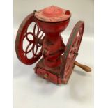 Red double wheel cast iron coffee mill with hand crank, marked Stowmarket Suffolk, Iron Foundry