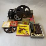 A Pathescope 9.5mm projector, a selection of 9.5mm films including Mickey Mouse, a Vest Pocket