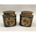 A pair of vintage printed tin tea caddies, of oval outline with domed cover, the green ground