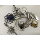A collection of designer silver jewellery c1970 including a fist brooch (London 1970), cabuchon