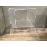 A pair of perspex coffee table formed as a continuous curve, 77cm wide