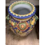 Tall Italian majolica twin handled floor vase, painted with lemons, grapes and plums in yellows,