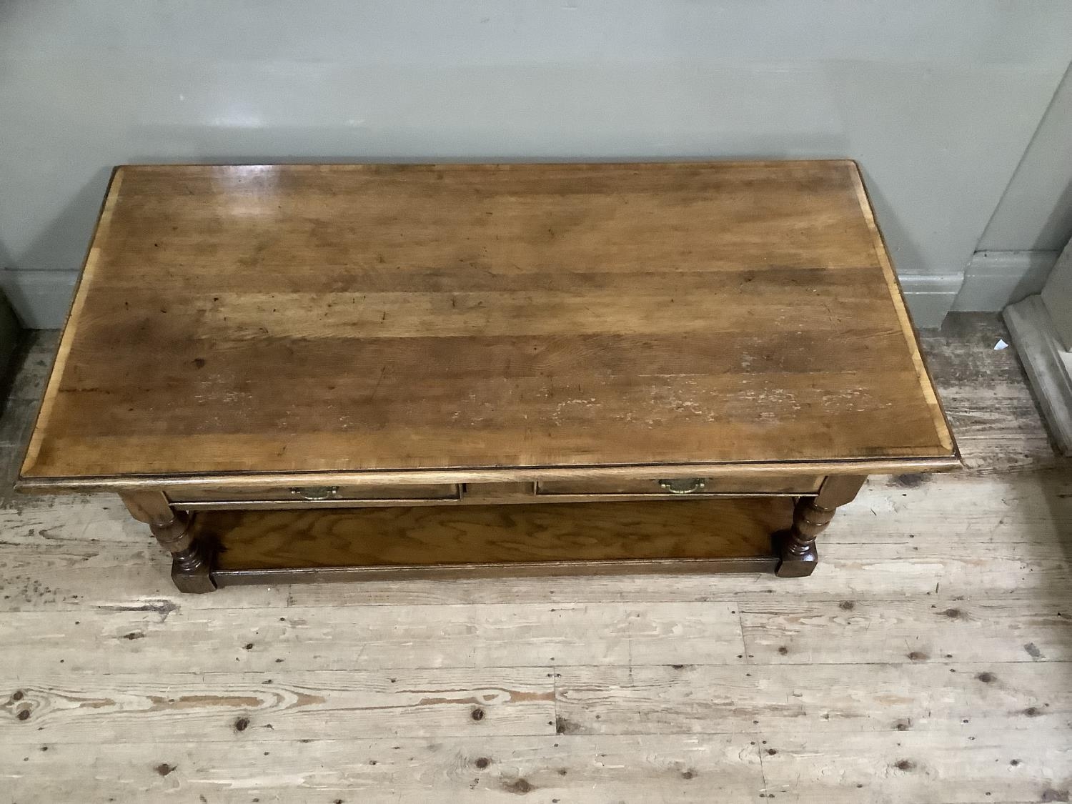 A reproduction oak coffee table, two small drawers, brass handles, on turned supports with under - Image 5 of 6