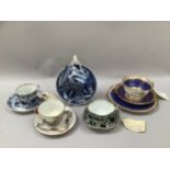 A collection of 19th Century cups and saucers, including an early 19th Century French cup and saucer