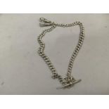 A George V silver double guard watch chain in graduated curb links with T-bar and swivel fastener,