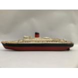 A scratch built Cunard liner on stand with rudder, twin propeller, chimney and fencing