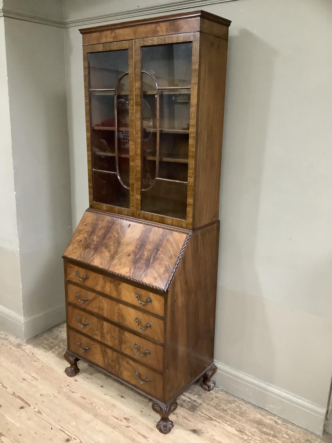 An early 20th Century mahogany and walnut bookcase with hinged fold down front opening to reveal - Image 2 of 2