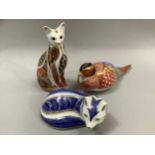 Three Royal Crown Derby paperweights comprising pheasant, arctic fox and cat all with gold stoppers