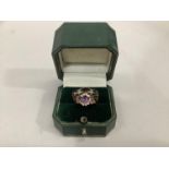 An amethyst and cubic zirconia cluster ring in 9ct gold together with a garnet and turquoise boat