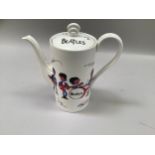 Washington Hanley coffee pot featuring caricatures of The Beatles, with the brands signatures,