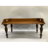 A mahogany bed tray with pierced sides on turned legs, 61.5cm by 34cm