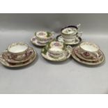 Pair of 19th century cabinet cup trios with floral sprays and gilt two further cups and one saucer