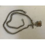 An Edward VII silver double guard watch chain in graduated curb links with T bar, one swivel