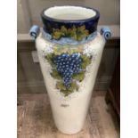 Tall Italian majolica twin handled floor vase with narrow neck painted with fruit, 85cm high
