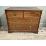 An Edwardian mahogany and satinwood cross banded chest of two short over two long drawers with brass