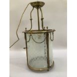 A glass and brass mounted ceiling lantern with four moulded arms, the glass etched with floral
