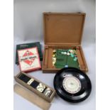 A vintage K & C Ltd roulette wheel, boxed; together with a travel Monopoly game by John Waddington &