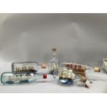 Five ships in bottles including mayflower, USS Constitution and two others