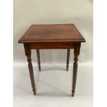 A small reproduction side table on turned and reeded legs, the top inlaid, 38cm wide