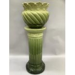 19th century cylindrical jardiniere with fluted body and foliate base and graduated green glaze, the