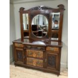 A Victorian Mahogany sideboard with three drawers above two drawers surmounted by two cupboards with