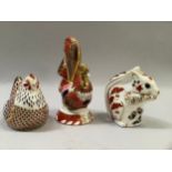 Two Royal Crown Derby paperweights comprising squirrel and hen both with gold stoppers together with