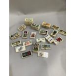 A collection of vintage Brooke Bond cigarette cards to include trains of the world, racing scenes,