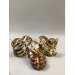 Three Royal Crown Derby paperweights Cottage Garden Cat, together with two others with gold stoppers