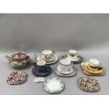 A collection of china trios, cups and saucers, plates and a Japanese export teapot, the latter A/