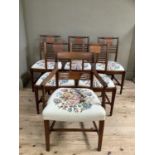 A set of five Regency style mahogany dining chairs with tapestry seats together with a carver