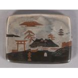 A JAPANESE SILVER CIGARETTE CASE , inlaid with mountainous lake scenes, pagodas and trees in