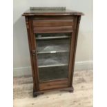 An Edwardian mahogany, bevel glass fronted music cabinet with glazed bevelled glass single door