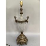 A glass and gilt metal mounted lamp base, the glass body having hobnail type decoration flanked by