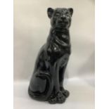 A pottery figure of a black panther, measuring 82cm high