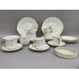 A Royal Crown Derby gilt edged tea service comprising eight cups, eight saucers, eight tea plates