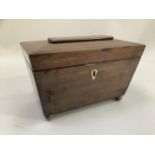 Mahogany sarcophagus tea caddy with two interior compartments, bone cartouche to front on brass