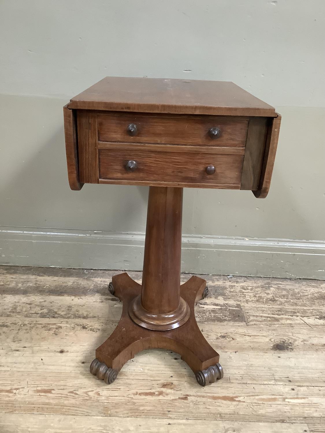 A Victorian rosewood work table with two drop leaves, two long drawers, on column supports with - Image 2 of 3