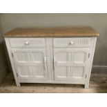 A painted Ercol sideboard, two panelled doors opening to reveal shelving on rail below two drawers