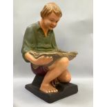 Early 20th century polychrome figure of a boy crouching with glass basin, 58cm high