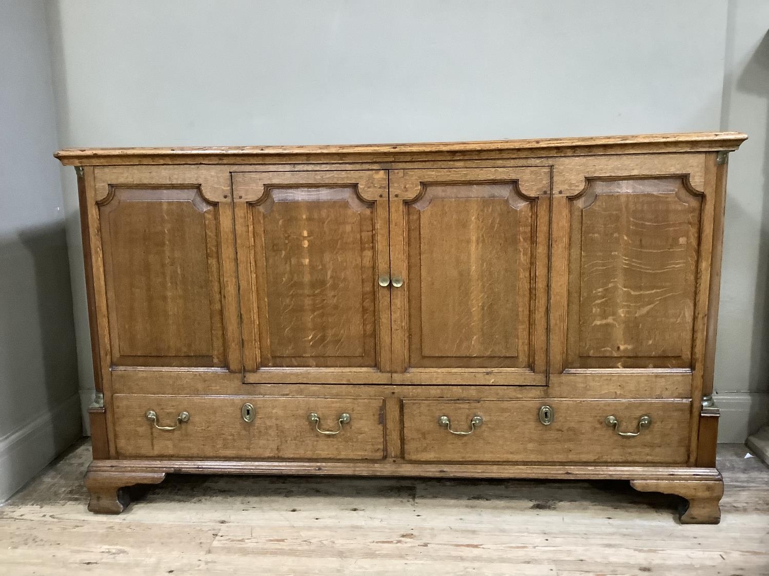 Victorian oak sideboard with two doors above two long draws with brass escutcheons and swan-necked - Image 2 of 2