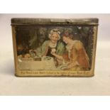 An early 20th century printed tin Mazawattee tea caddy printed with a young woman looking for love-