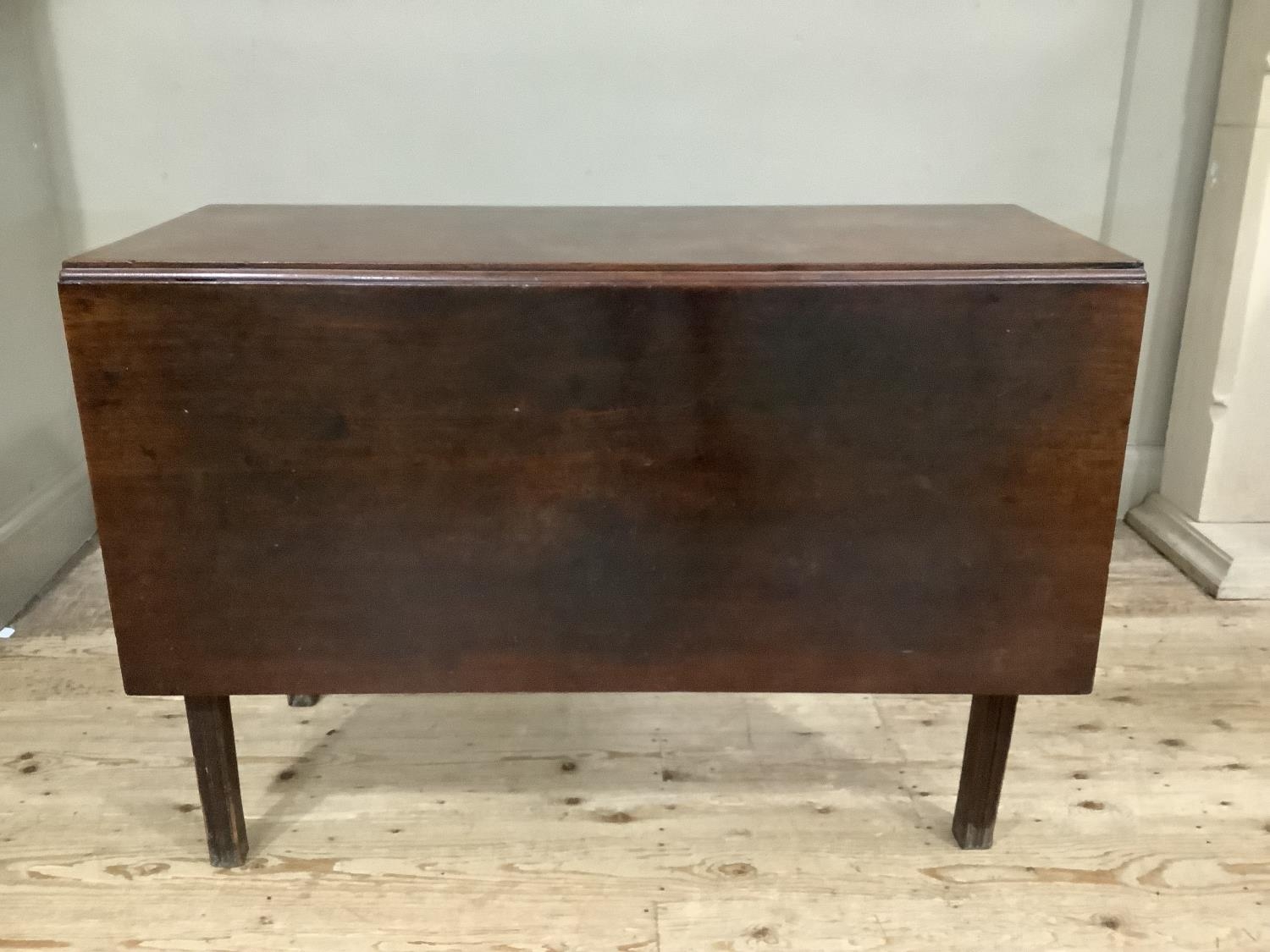 A Victorian mahogany drop leaf dining table, 135cm, on square legs with five dining chairs