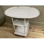 A painted Ercol drinks trolley with two tiers on casters, 72cm