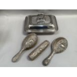 An Edward VII silver three piece silver dressing table set by Walker and Hall, Sheffield 1908,