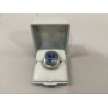 A turquoise lapis lazuli and carnelian mosaic set signet ring in white metal (tests as silver),