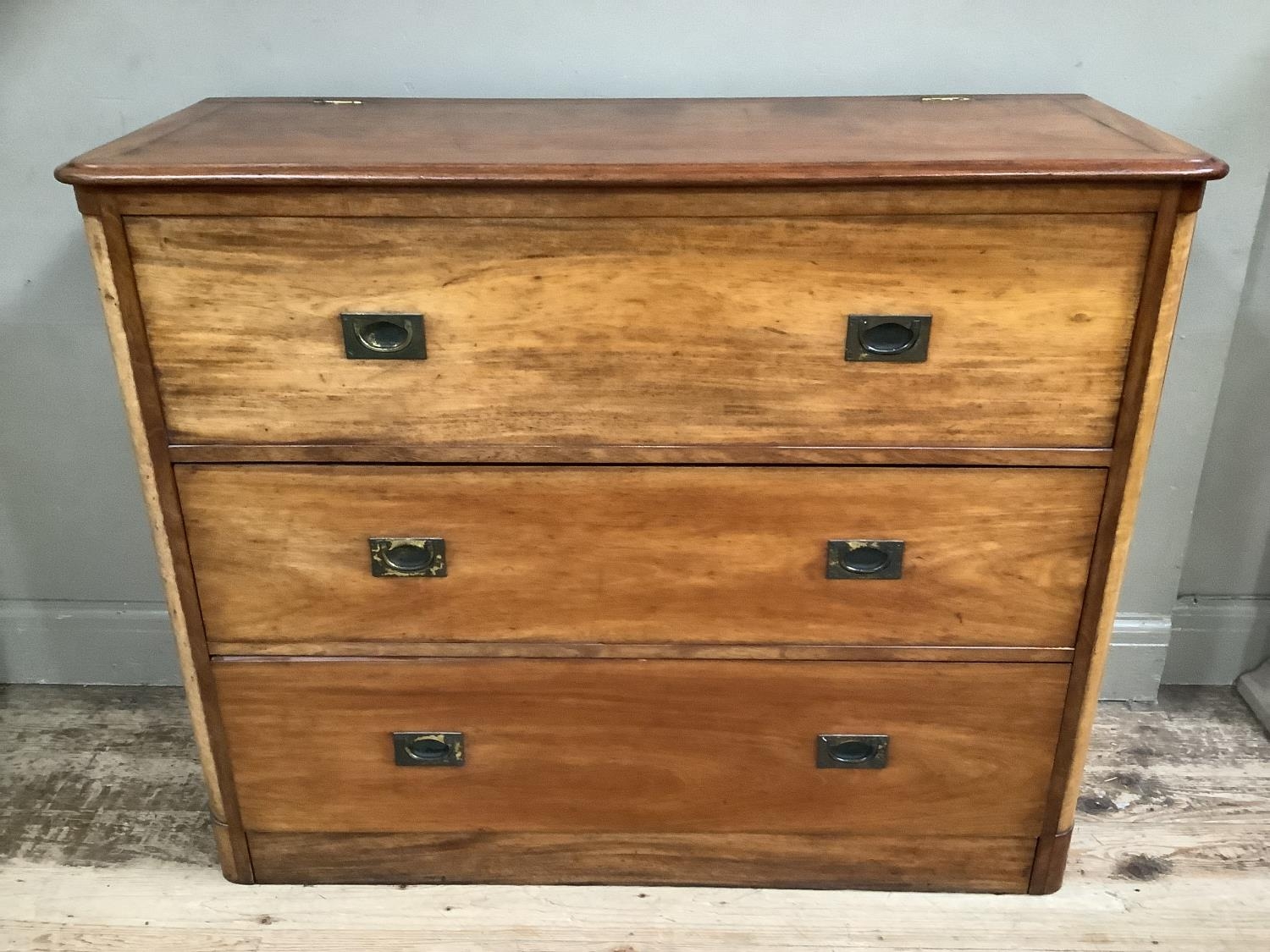 A Victorian satin wood campaign chest with colonnade ends with lift up top with three long drawers