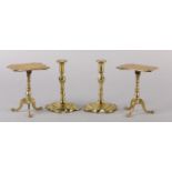 A PAIR OF EARLY 19TH CENTURY BRASS CANDLESTICKS, inverted baluster stem and petalated square base,