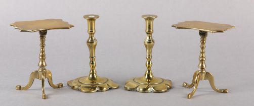 A PAIR OF EARLY 19TH CENTURY BRASS CANDLESTICKS, inverted baluster stem and petalated square base,