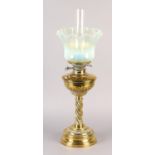 A VICTORIAN BRASS OIL LAMP, with wrythen lobed reservoir and wrythen column on circular stepped