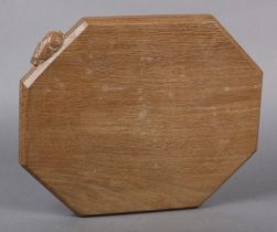 PETER HEAP OF WETWANG 'RABBITMAN' An oak bread or cheeseboard of irregular octagonal outline, carved